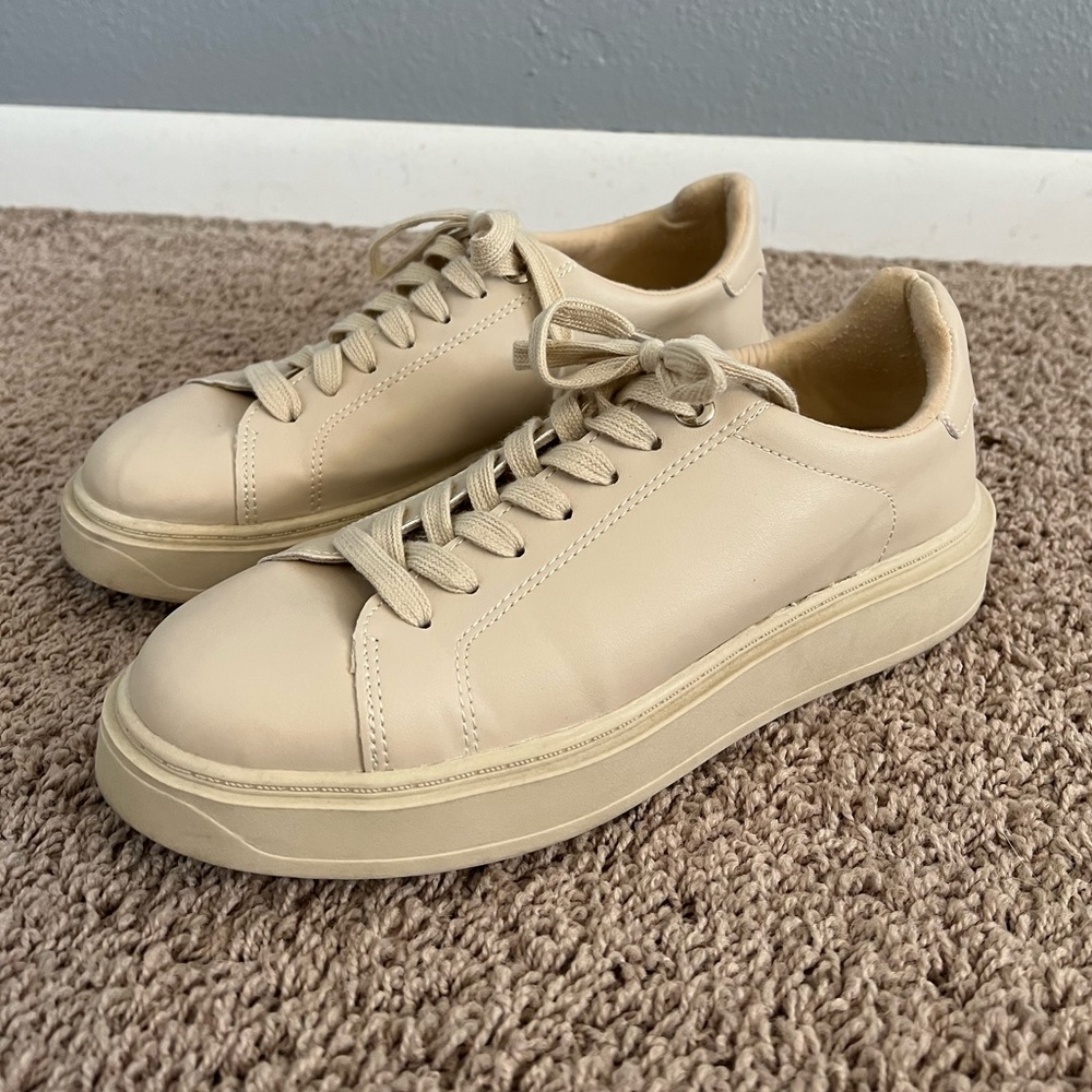 Woman’s tan Sneakers